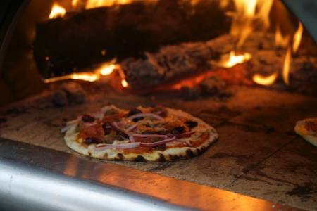 pizza in a wood fired oven